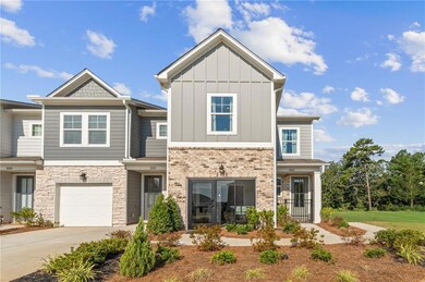 Craftsman inspired home featuring concrete driveway, board and batten siding, french doors, and an attached garage