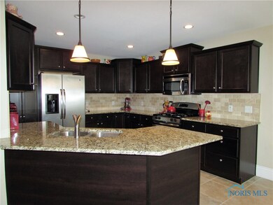 Kitchen with Granite Counters and Breakfast Bar
