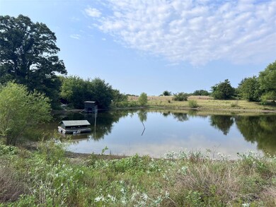View of water feature with a boat dock