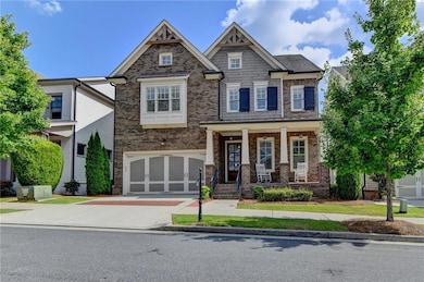 Craftsman-style house featuring concrete driveway,