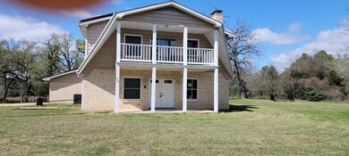 View of front of home featuring a front yard and a