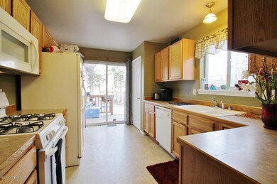 Kitchen & Dining w/ door to deck