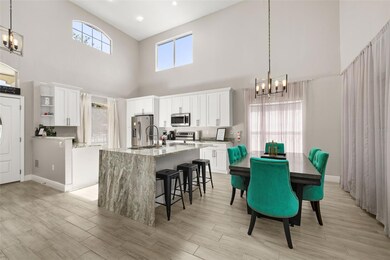 Kitchen and Dining with Waterfall island