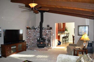 The freestanding woodstove and brick hearth are th