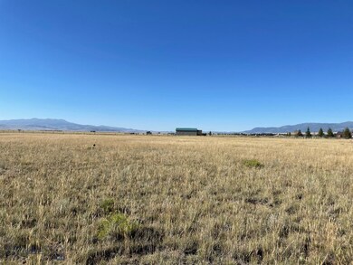 View north with neighboring house in the distance