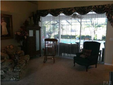 Great room with four tier sliding doors overlooking the pool