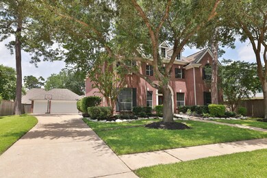 Extended 3 car garage offers plenty of off street