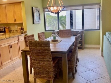 Dining room with light tile patterned floors