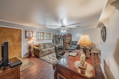 Living room featuring ornamental molding, ceiling 