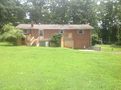 Back of home with new deck railing