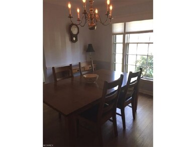 The dining room has a picture window allowing the 