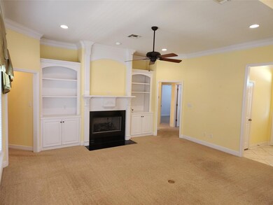 Gas fireplace and built-ins in living room.