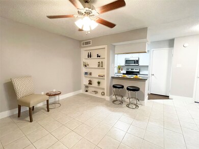 View of the living/ dining combo area and kitchen.