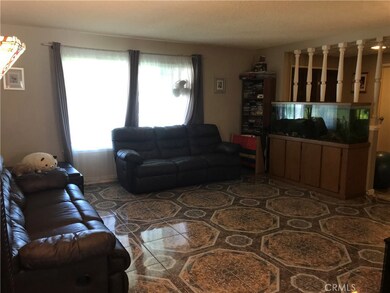 Another view of living room and entry.