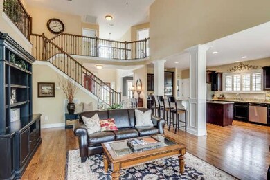 The large family room is the centerpiece of the house and is open to the kitchen and the second story.  