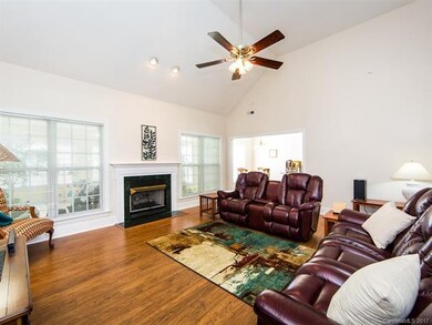Large family room with gas log fireplace.