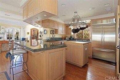 Chef's modern kitchen with granite counters, stain