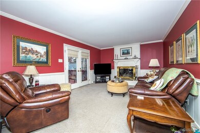 Family Room has fireplace & Fr. doors to deck