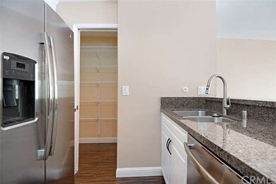 Walk-in pantry with pocket door.