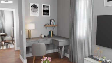 Home office with wood finished floors