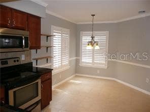 Light and bright eat in area is enhanced by these lovely Plantation Shutters.