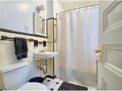 Bathroom. UPDATE TILE BATH WITH BLACK AND WHITE TI