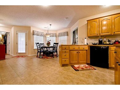 Kitchen. Spacious kitchen with access to additional eating area, ample storage and counter space.