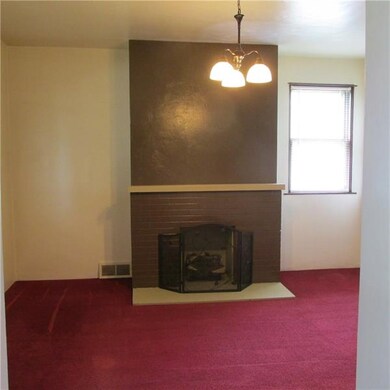 Living Room with gas fireplace.  Hardwoods under c