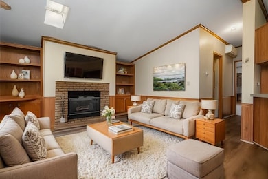 Virtually staged Living room with the brick firepl