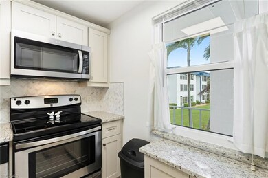 Kitchen with stainless steel appliances, light sto