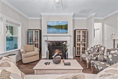 Living area with dark wood finished floors, visibl
