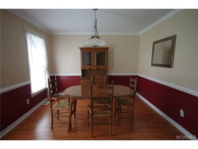 Formal Dining Room has Crown Moulding and Chairrai