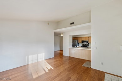Unfurnished living room featuring light wood-type