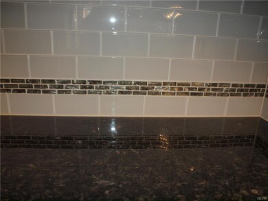 Glass tile is accented with a beautiful opalescent