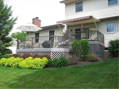 Multi-level composite deck with awning and gas gri