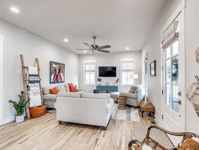 Living room with recessed lighting, light wood-typ
