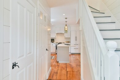 View of Kitchen and Stairway from the Front Entryway