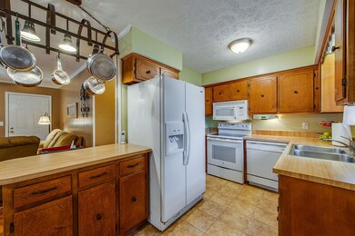Kitchen offers an island and tons of cabinet storage.