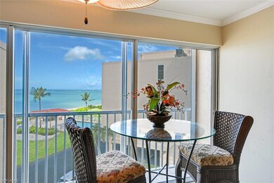 Sunroom featuring a water view