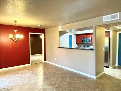 Dining area featuring kitchen access.