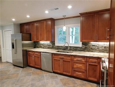 The open kitchen has plenty of room for a breakfas