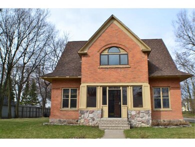 The brick, wood and stone exterior looks like it w