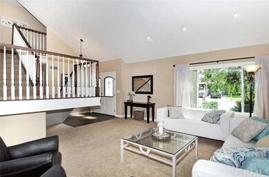 Living room with windows toward front of home