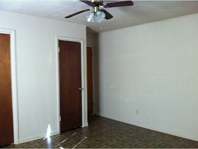 Master Bedroom. Built ins and exterior door to bac