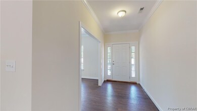 Front foyer. Buyer can still choose flooring. Phot
