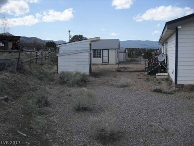 Rear Outbuildings - Carport / 3 Storage Areas