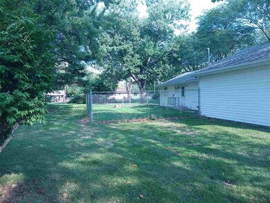 The back yard is much larger than the fenced area.