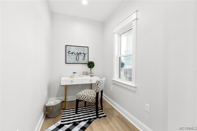Office space featuring light hardwood / wood-style