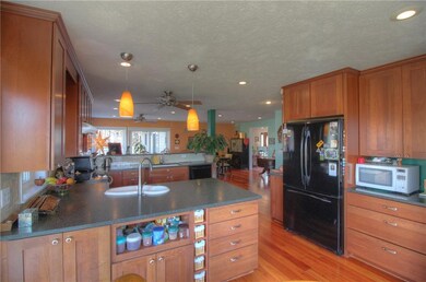 Closer look at kitchen showing multiple cupboards 