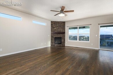 Main level living room with hardwood flooring, cei